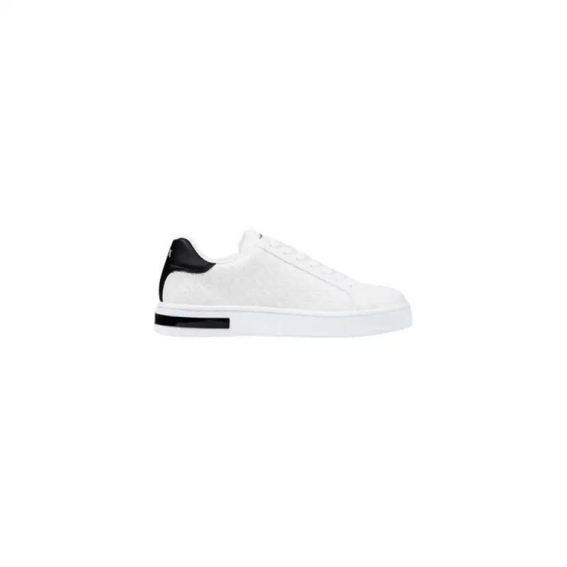 White leather sneaker featuring black heel accent for stylish footwear collection