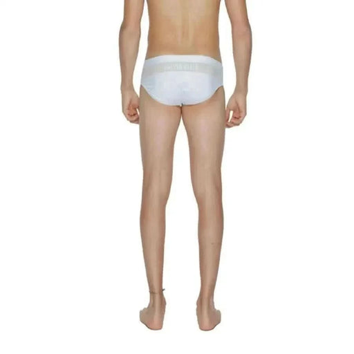 Calvin Klein Men Swimwear white briefs displayed on a mannequin’s lower body