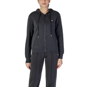 Woman wearing Guess Active Black Long Hooded Zip Sweatshirt with matching sweatpants