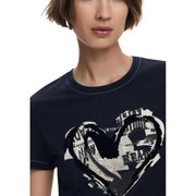 Woman wearing Desigual black print short sleeve round neck T-shirt with heart graphic