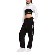 Woman wearing Karl Lagerfeld black and white two-piece outfit with cropped shirt and sweatpants