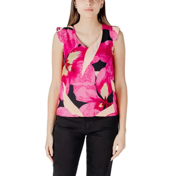 Woman wearing floral print sleeveless top, ideal for casual and summer wear