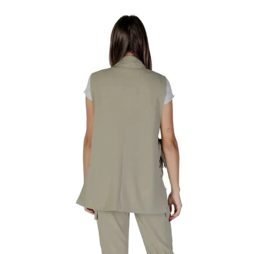 Woman wearing a Green Sleeveless V-Neck Gilet with Front Pockets by B.young