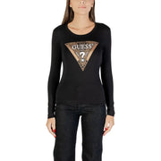 Woman wearing Guess long-sleeve black round neck T-shirt with gold and black patterned logo