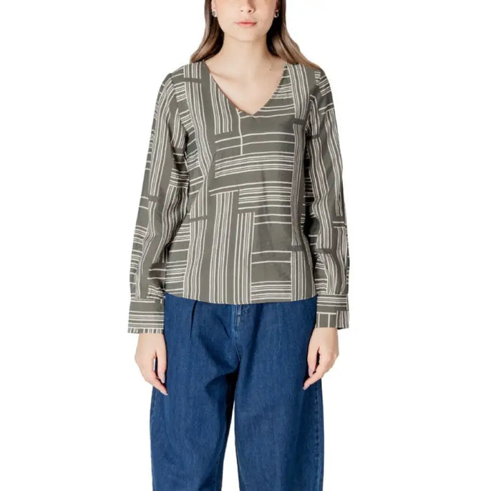Woman wearing a long-sleeved patterned blouse from the Women’s Patterned Long Sleeve Blouse collection