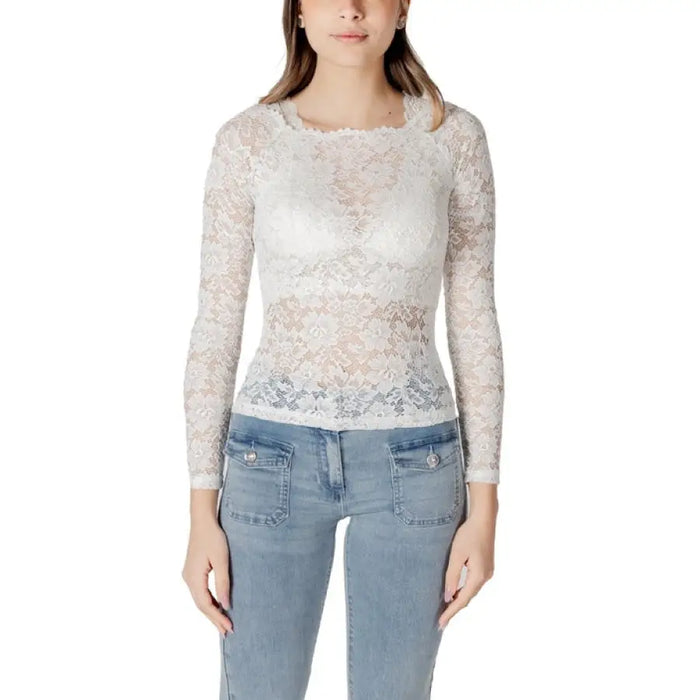 Elegant white lace long-sleeve top for women showcasing delicate craftsmanship