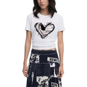 Woman wearing Desigual black print short sleeve round neck T-shirt with navy newspaper print skirt