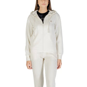 Women wearing beige full-zip hooded tracksuit with black T-shirt, Guess Active Women sweatshirt