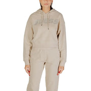 Women’s beige hooded sweatshirt and matching sweatpants from Guess with rhinestone details