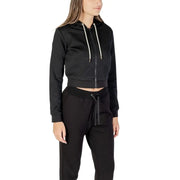Women’s black cropped zip-up hoodie and matching sweatpants from Guess Active for fall winter