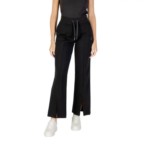 Women’s black flared sweatpants with drawstring waist and front slits from Armani Exchange