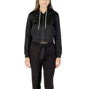 Women’s black full-zip cropped hoodie and matching sweatpants from Guess Active collection