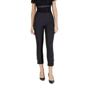 Women’s black high-waisted capri trousers with buckle cuffs, paired with a lace top and heels