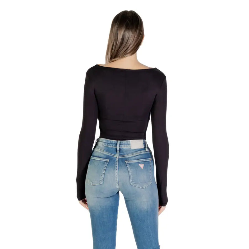 Women wearing black boat neck long-sleeve viscose blend T shirt and blue denim jeans