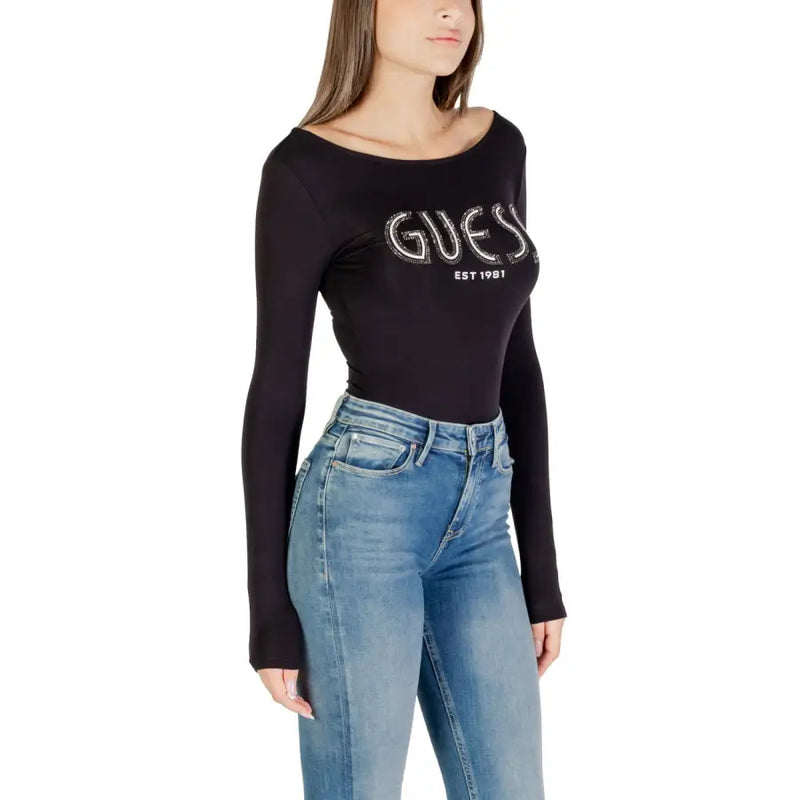 Women wearing black Guess long-sleeved boat neck logo T-shirt with blue jeans