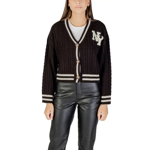 Women’s black cable knit cardigan with white stripes and NY patch for fall winter fashion