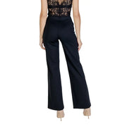 Women wearing Guess Active Fall Winter black high-waist wide-leg trousers with lace top and nude heels