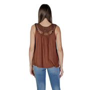 Women’s brown sleeveless viscose tank top with decorative cut-out neckline and light blue jeans