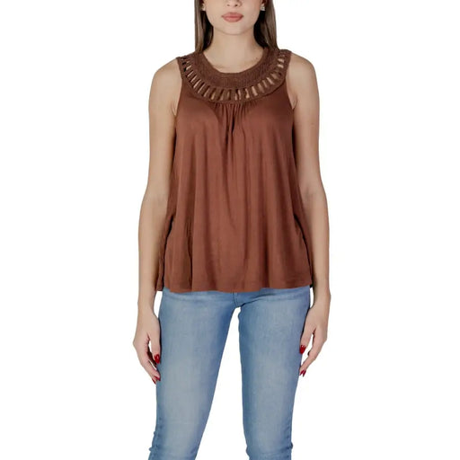Women wearing a brown sleeveless viscose tank top with a crochet neckline and light wash jeans