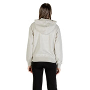 Women’s light gray hooded zip sweatshirt and black pants from Calvin Klein Jeans