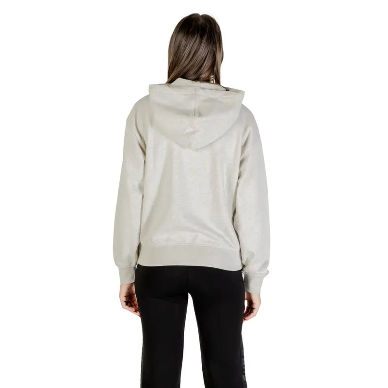 Women’s light gray hooded zip sweatshirt and black pants from Calvin Klein Jeans