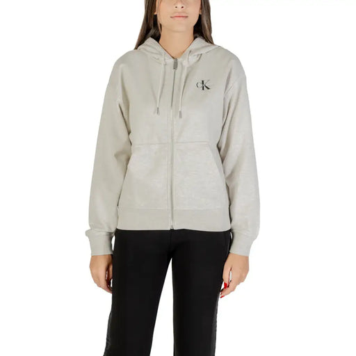 Women’s light grey zip-up hoodie with black CK logo on chest from Calvin Klein Jeans