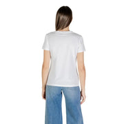 Women wearing Guess Active white printed short sleeve round neck T shirt with blue wide-leg jeans