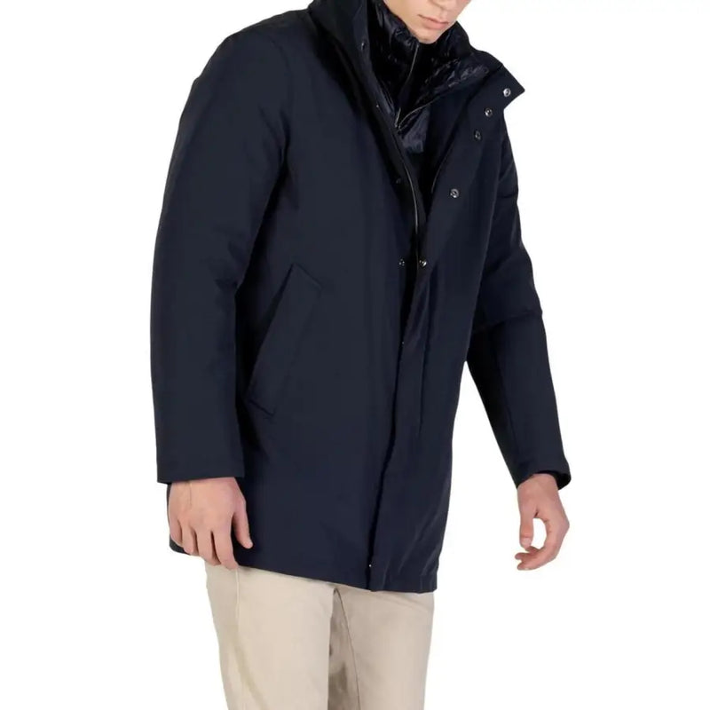 Navy blue down-filled parka with hood and quilted lining, designed by kenneth cole new york.