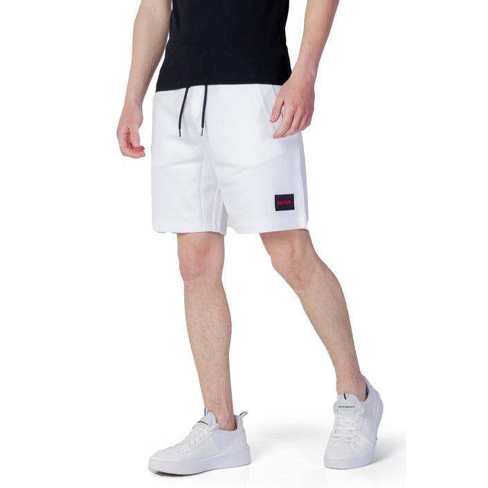Stylish man in urban city wearing men’s shorts