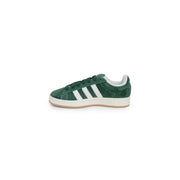 Green adidas gazelle sneakers with white stripes and suede texture.