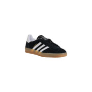 Black and white adidas samba indoor soccer shoe with gum sole.