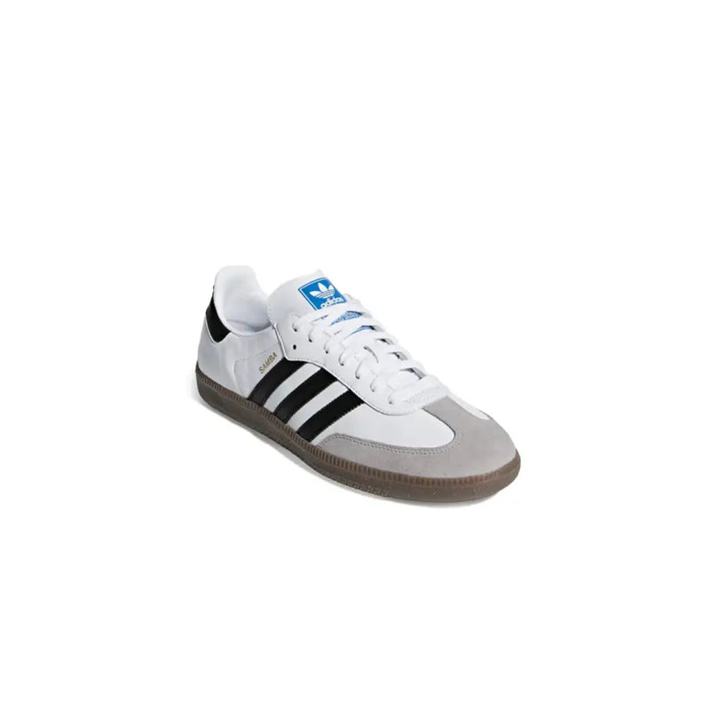 Adidas Baskets homme en cuir blanc style sportif B75806 avec tige blanche et grise, rayures noires, logo bleu et semelle marron