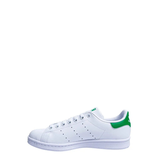 White leather adidas stan smith sneaker with vibrant green synthetic heel tab and matching green branding on the tongue