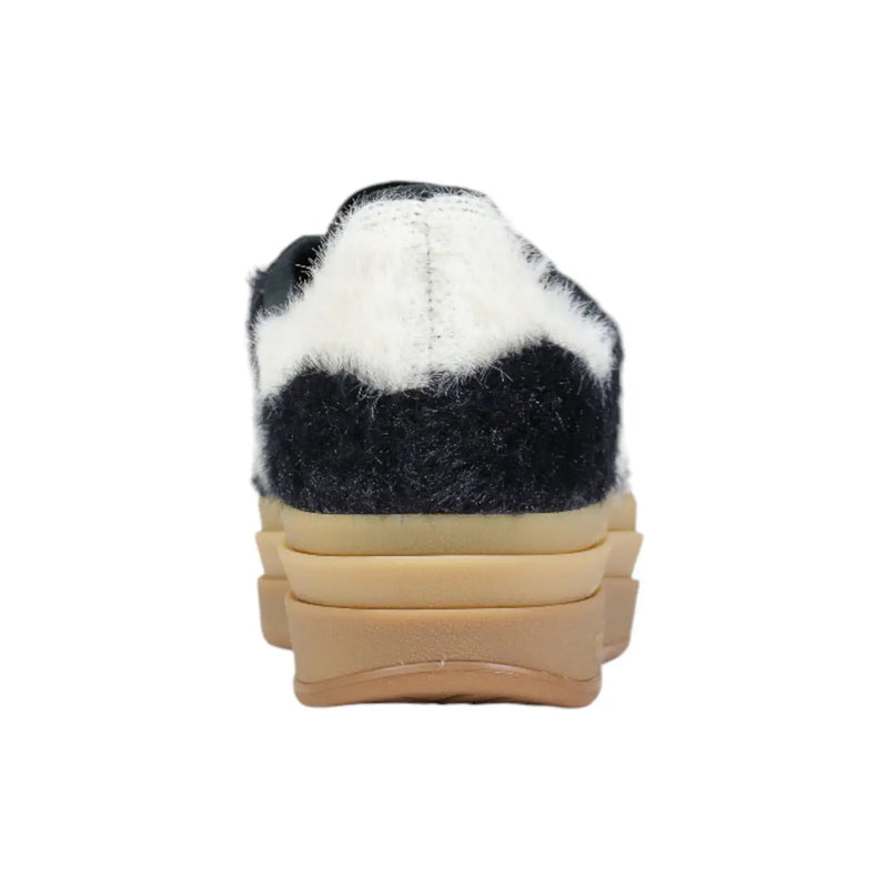 Adidas Originals women black leather sneakers with fuzzy black and white slip-on design and layered tan platform sole