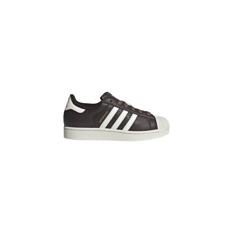 Adidas women leather superstar sneaker in black with white rubber toe cap and three stripes design