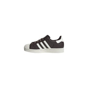 Adidas women leather superstar sneakers brown featuring dark brown suede upper white rubber toe cap and three stripes
