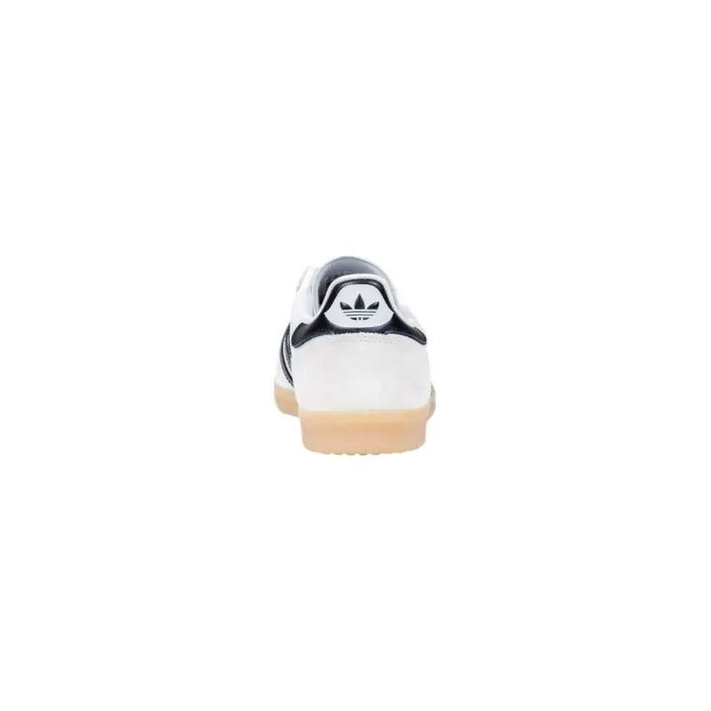 Adidas women white faux leather slip on sporty sneaker with black accents and gum-colored rubber sole