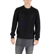Black ribbed crew neck sweater with long sleeves and a relaxed fit.