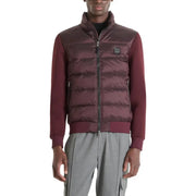 Burgundy quilted down vest with zipper closure and logo patch on chest.