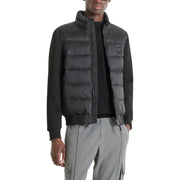 Black puffer vest with quilted design and zipper closure.
