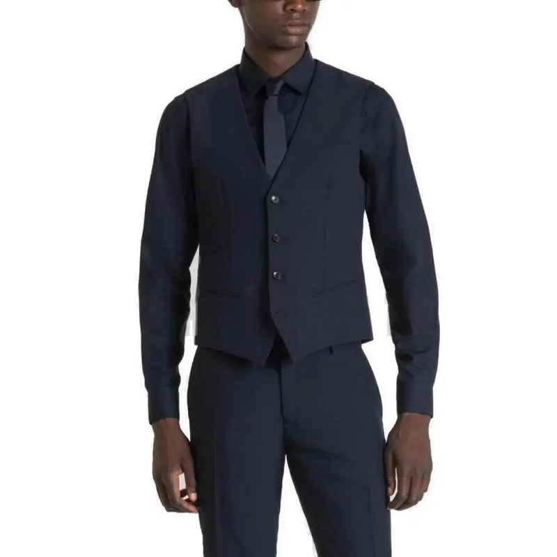 Navy blue wool three-piece suit with a vest, shirt and trousers.