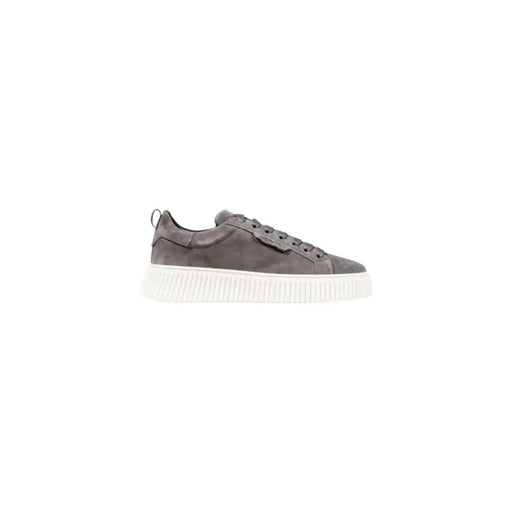 Grey suede sneakers with chunky soles and lace-up design.