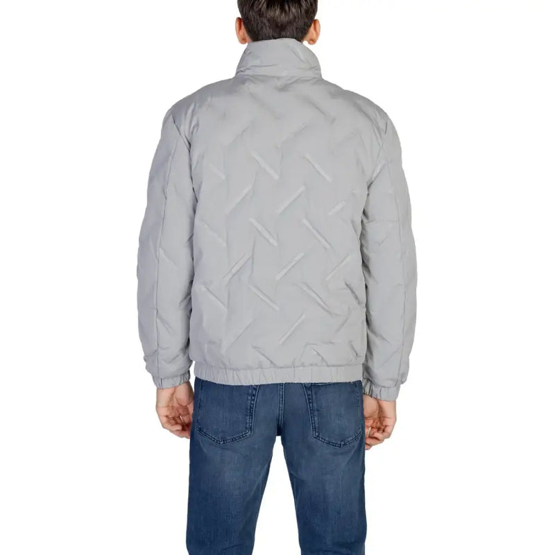 Light gray quilted jacket with high collar and pockets, likely made of polyester or nylon.