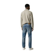 Antony Morato men beige cotton blazer worn over a beige cotton shirt with collar and long sleeves paired with blue jeans