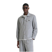 Antony Morato Chemise grise à manches longues pour homme, avec poche poitrine et logo noir discret sur le rabat de la poche.