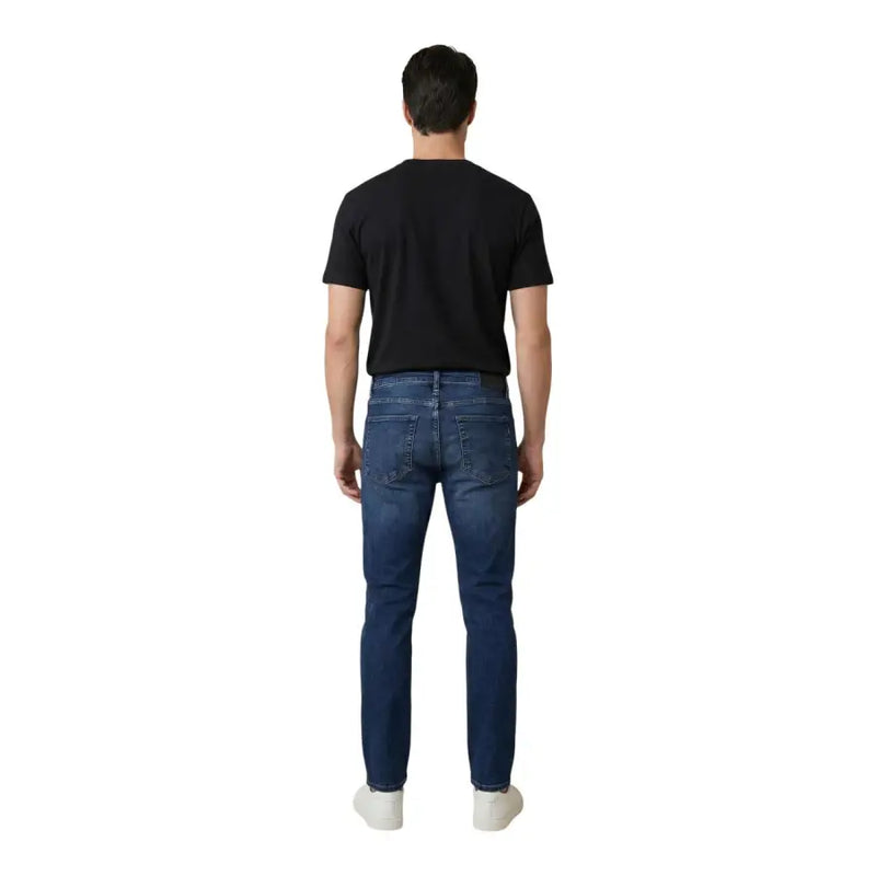 Antony morato Jean Ozzy pour homme, coupe fuselée, en coton bleu, vu de dos, avec un denim bleu foncé slim et des poches classiques.