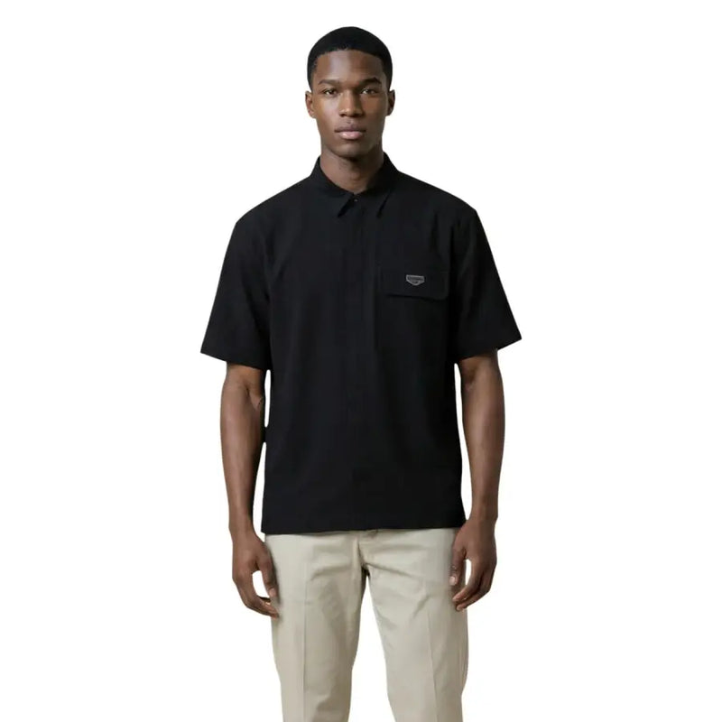 Antony Morato Polo noir à manches courtes pour homme, avec poche poitrine et logo discret, en coton.