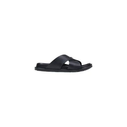 Antony Morato Sandales mules noires pour homme, modèle Kry, avec brides croisées minimalistes et semelle en caoutchouc texturée.
