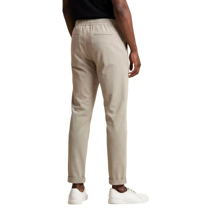Antony Morato men beige cotton blend corduroy trousers with relaxed fit and rolled cuffs
