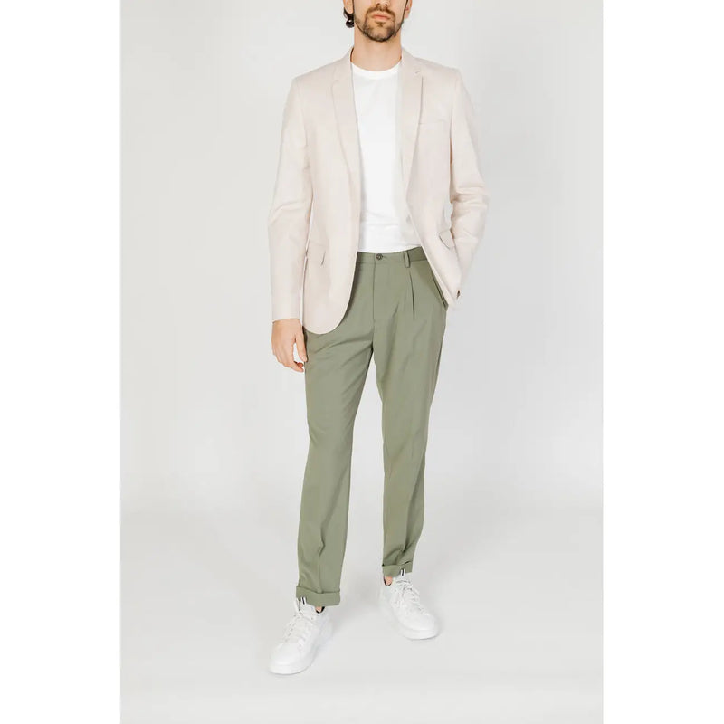 A man wearing an antony morato men white cotton blend blazer in light beige with olive green trousers